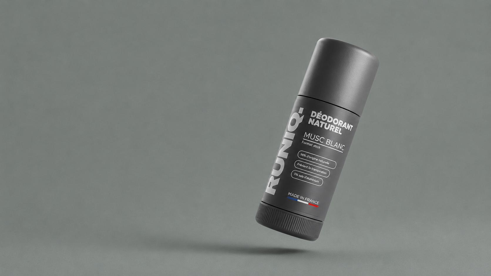 Déodorant RUNIQ Musc Blanc incliné sur fond gris
